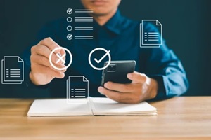 businessmen use computers for online auditing investigations and manage electronic documents on digital documents