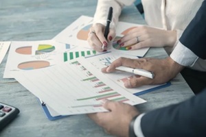 team working with sales schedules in the office