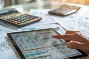 close-up shot of a digital invoice accounting and audit finance software on a tablet screen with a background