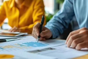 financial advisor presenting energy-saving solutions to business executives, energy efficiency audit concept