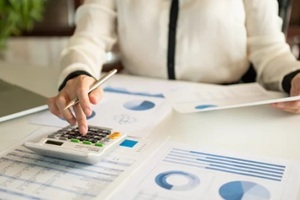 accountant or business people are calculate valuation and appraisal value of property business company and stock